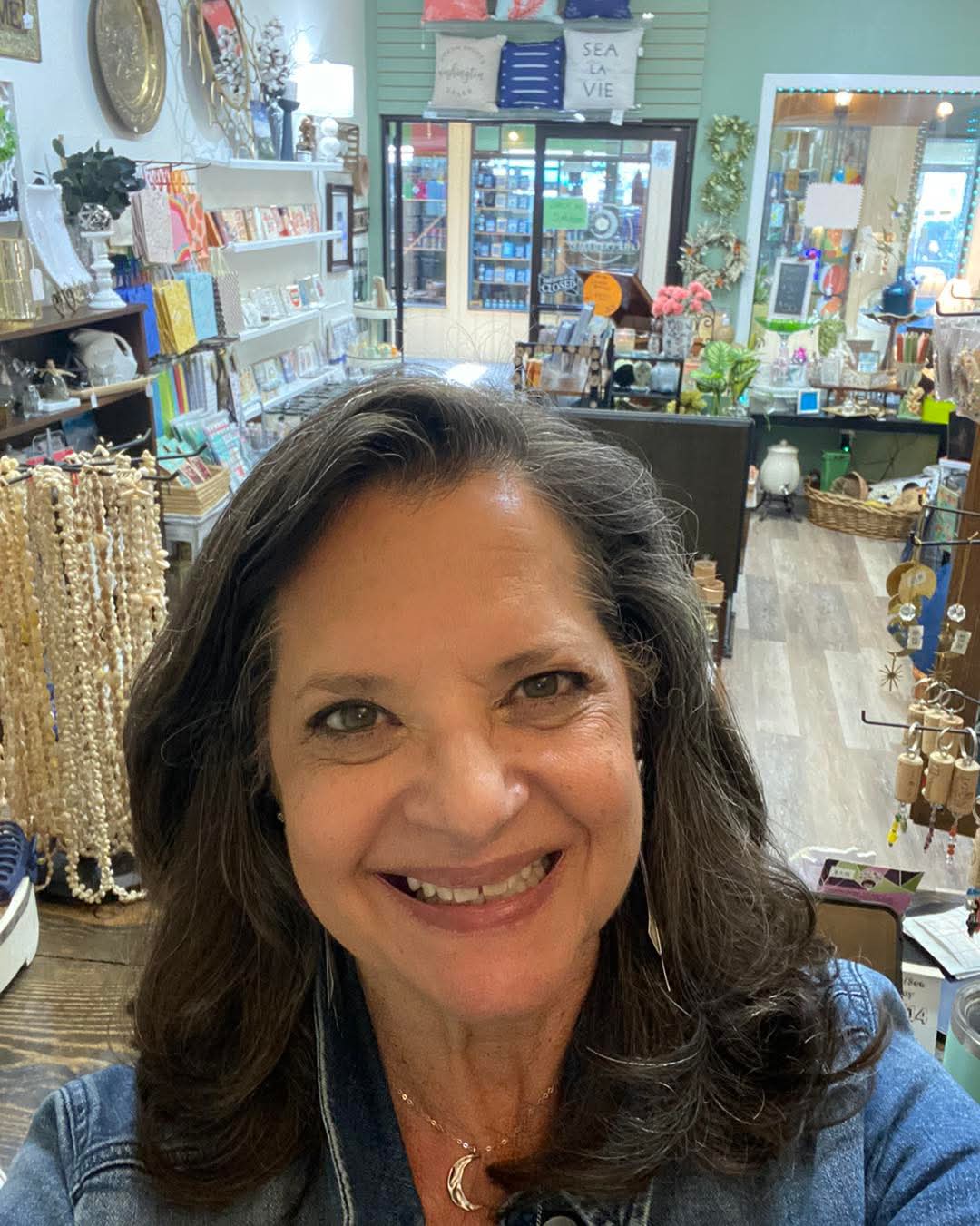 Pat Kelsey, owner of The Celtic Sunflower, smiling inside her shop